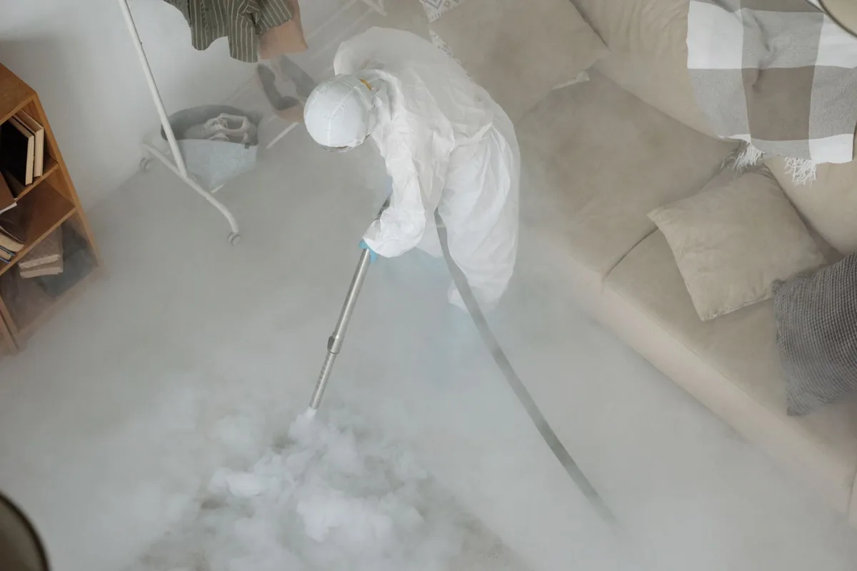 Biohazard cleanup technician in protective equipment, San Dimas, CA